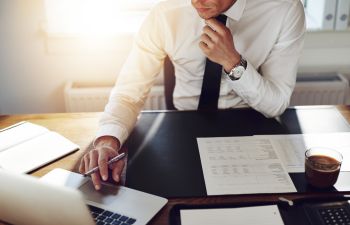 A businessman working in an office.