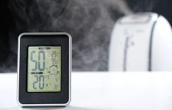 Hygrometer and thermometer with humidifier.